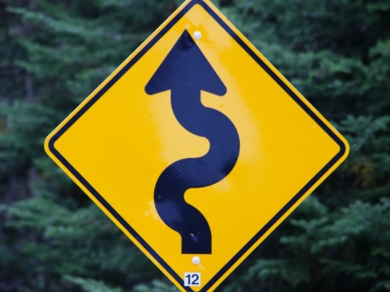 Sign displaying winding road