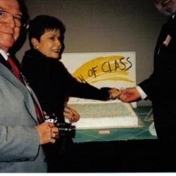 Faculty Cutting a Cake